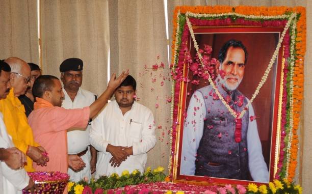 LUCKNOW, INDIA - APRIL 17: Uttar Pradesh Chief Minister Yogi Adityanath paying floral tribute to former Prime Minister Chandra Shekhar on his 91st birth anniversary at Assembly on April 17, 2017 in Lucknow, India. (Photo by Subhankar Chakraborty/Hindustan Times via Getty Images)